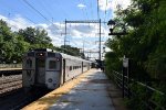 Arrow III Cab Car # 1435 trails on westbound Train # 3165 out of the depot as it heads to Jersey Ave Station in New Brunswick